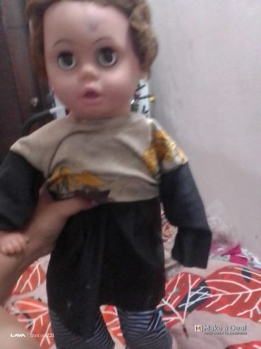 A rubber doll with rubber face hands and legs and the rest of the body is made of cotton