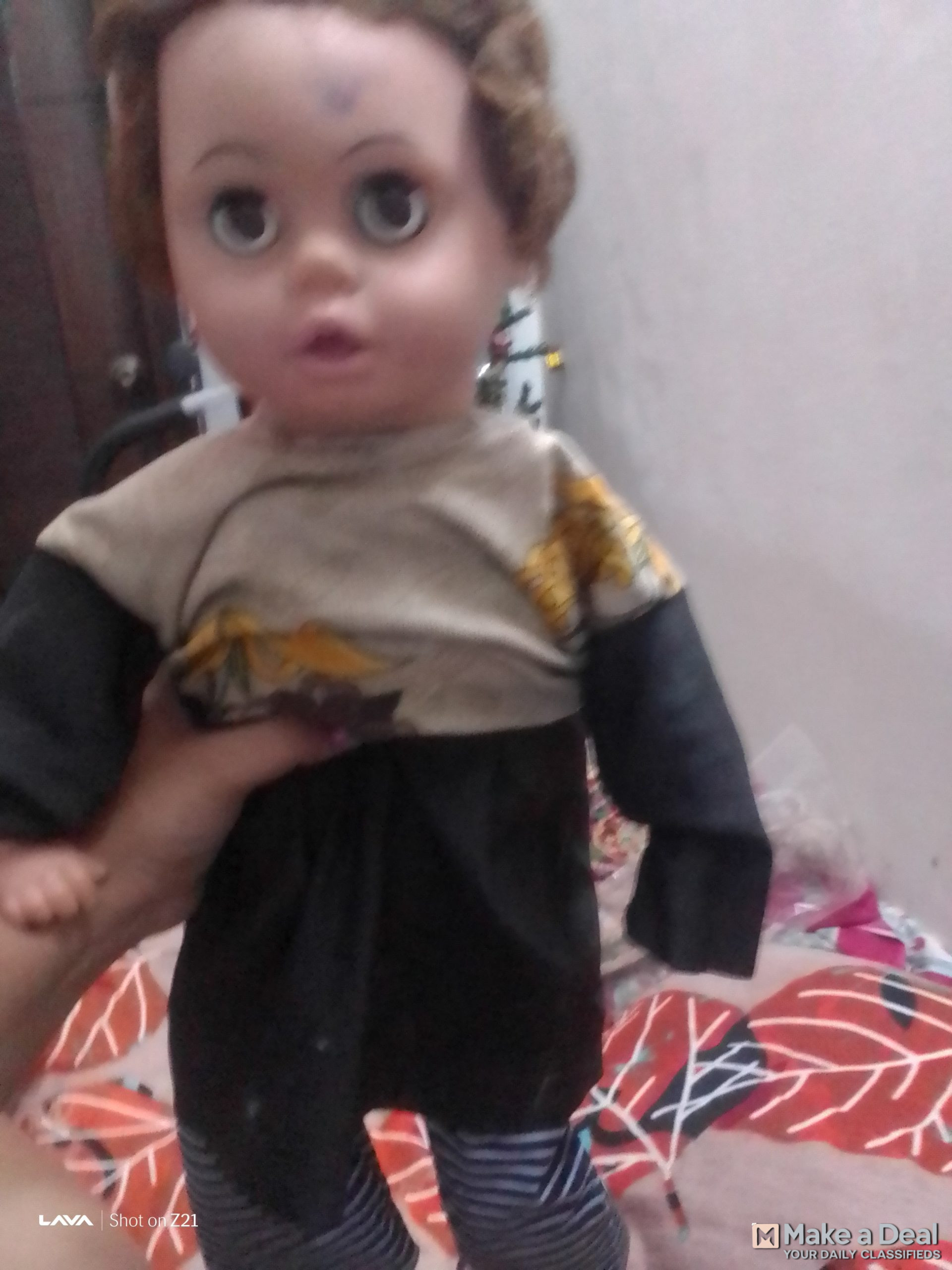 A rubber doll with rubber face hands and legs and the rest of the body is made of cotton