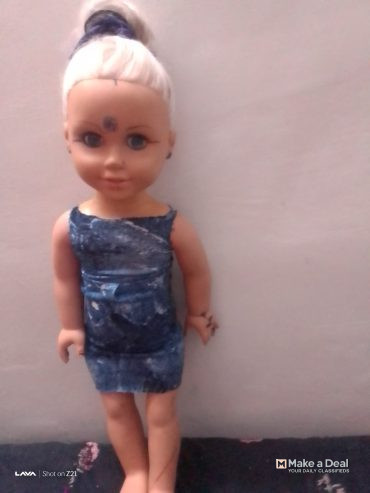 It’s a tall height big plastic doll